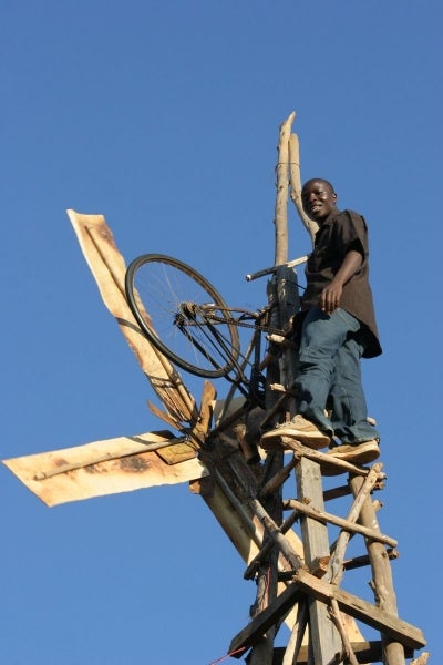Kamkawamba sits atop his homemade windmill