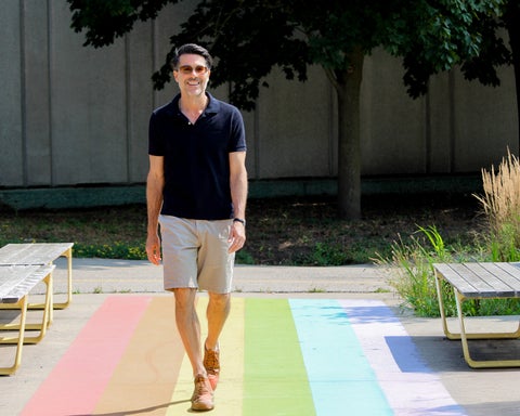 Brian Orend walking on rainbow crosswalk