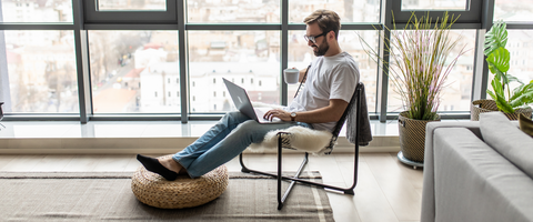 Man working on his computer at home