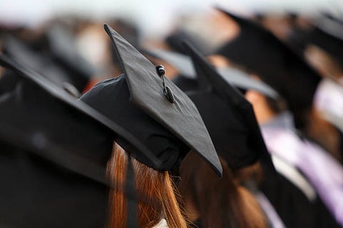 graduates wearing grad caps