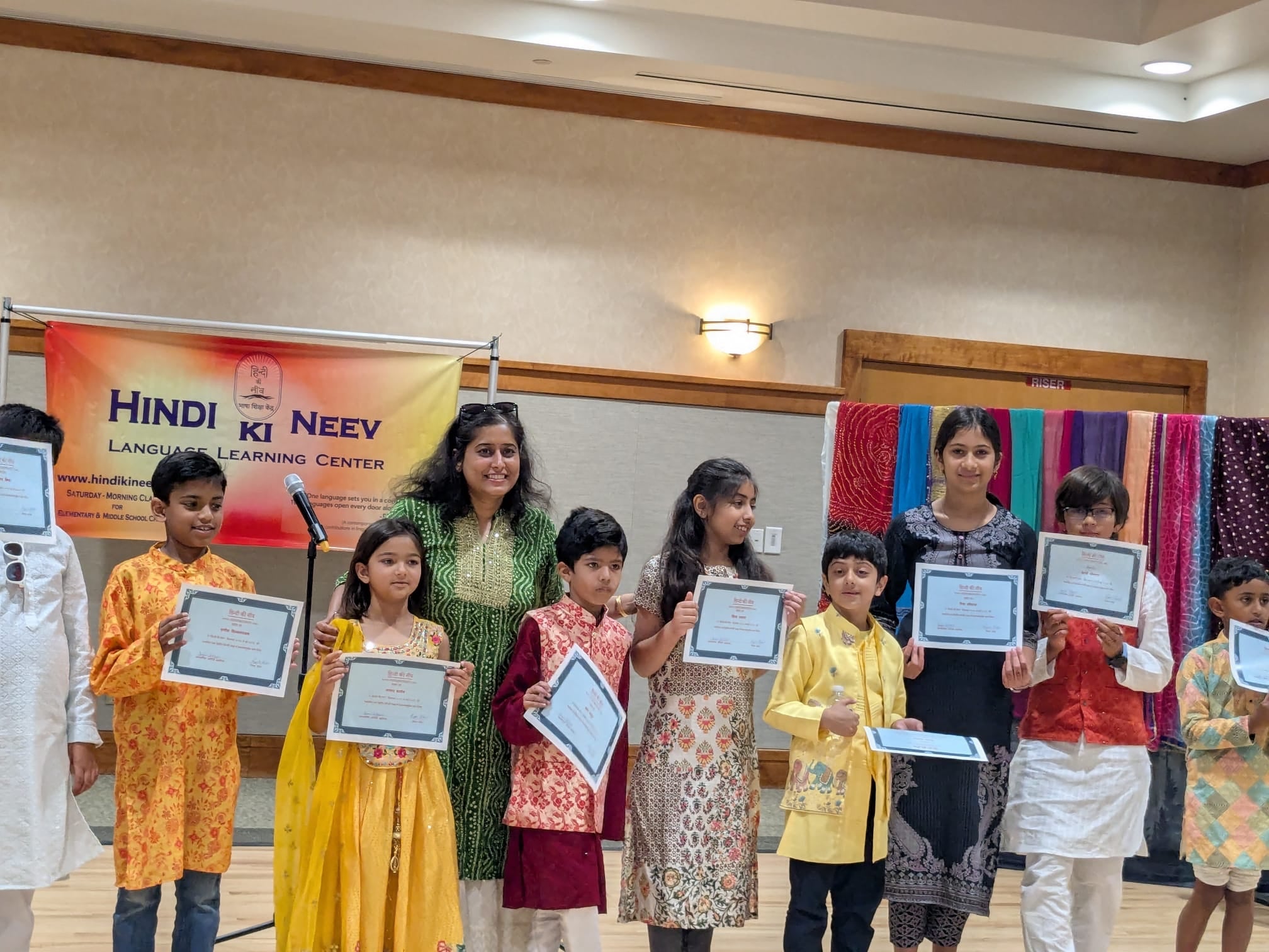 Ripple awarding her Hindi-school students on their year-end achievements