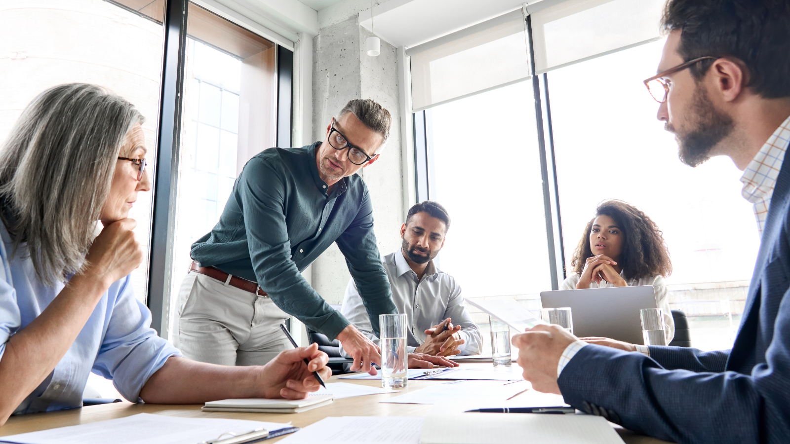 Man leading a team meeting