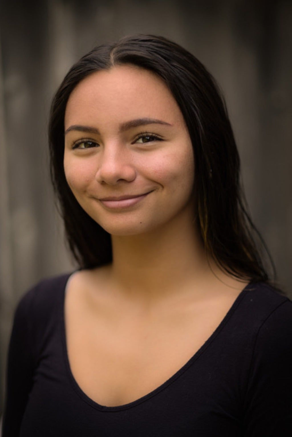 Dylan-Paige Andres smiles in a professional setting