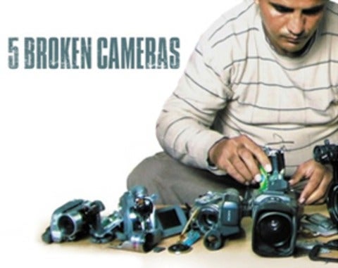 Man fixing cameras