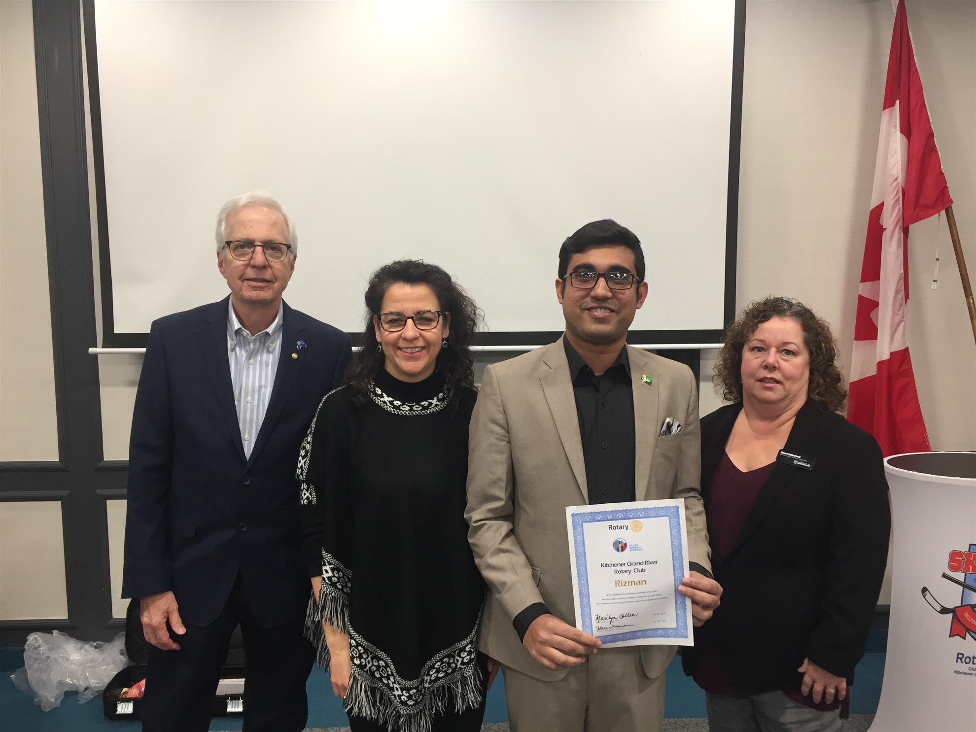 Rizwan joined by Ernie Ginzler and two faculty members Jennifer Ball and Sherri Sutherland.
