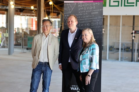 Dean Koenemann, Kevin Fong, and Sherry Shannon-Vanstone pose in the M4 construction site