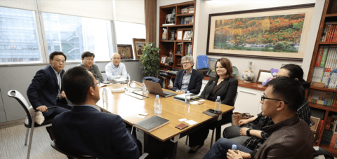 People around table at meeting