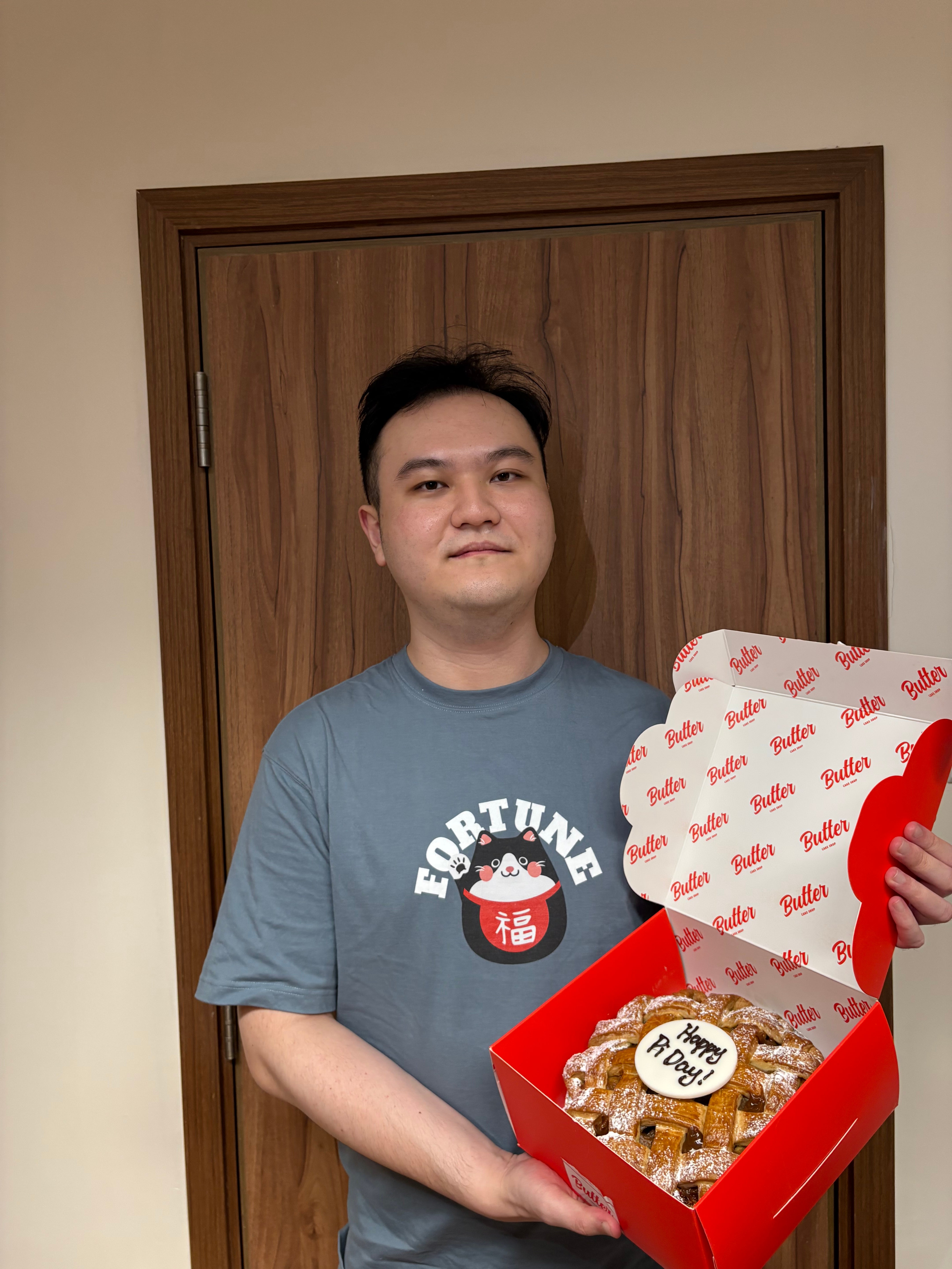 man holding a box with a pie inside