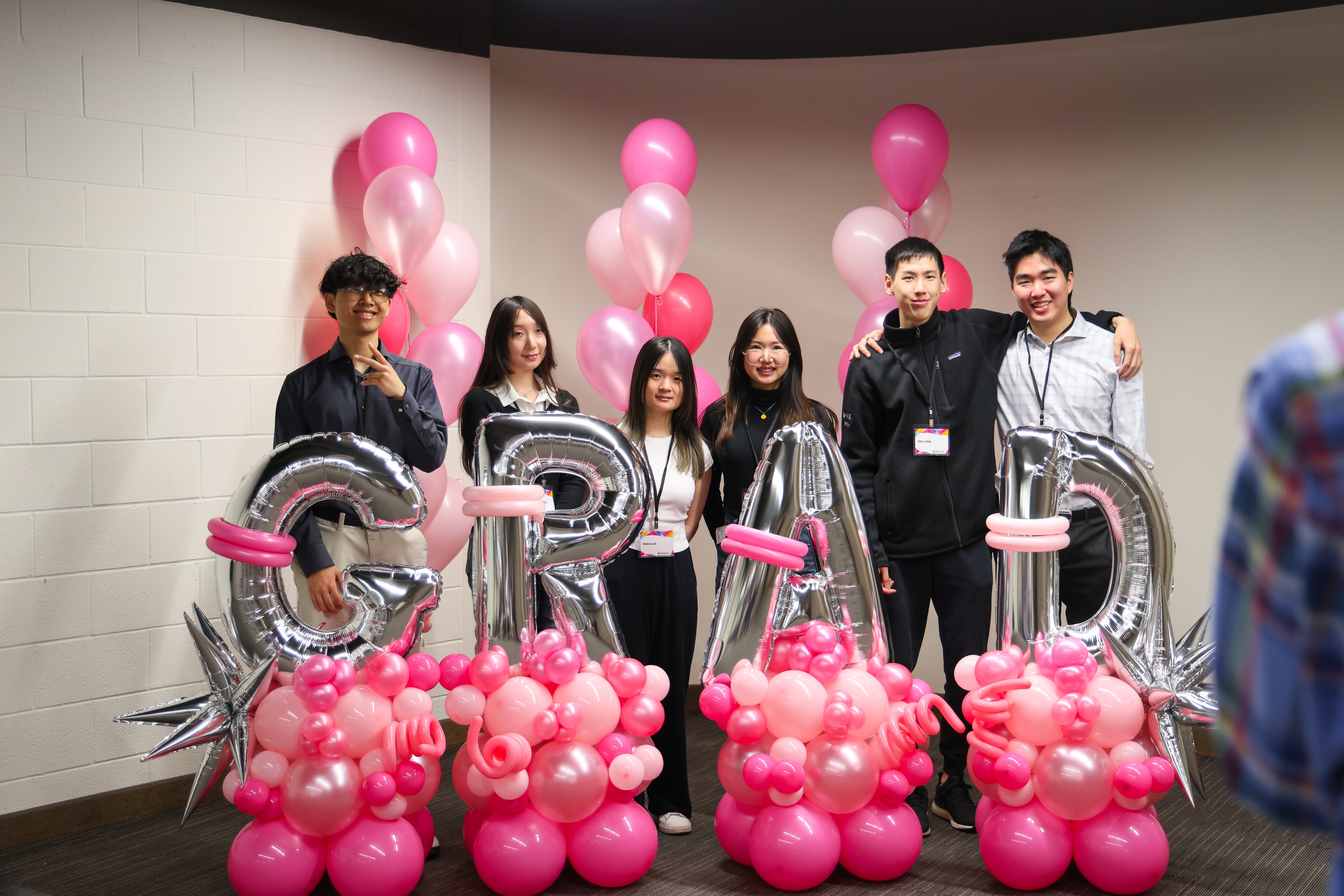 group of people standing and smiling
