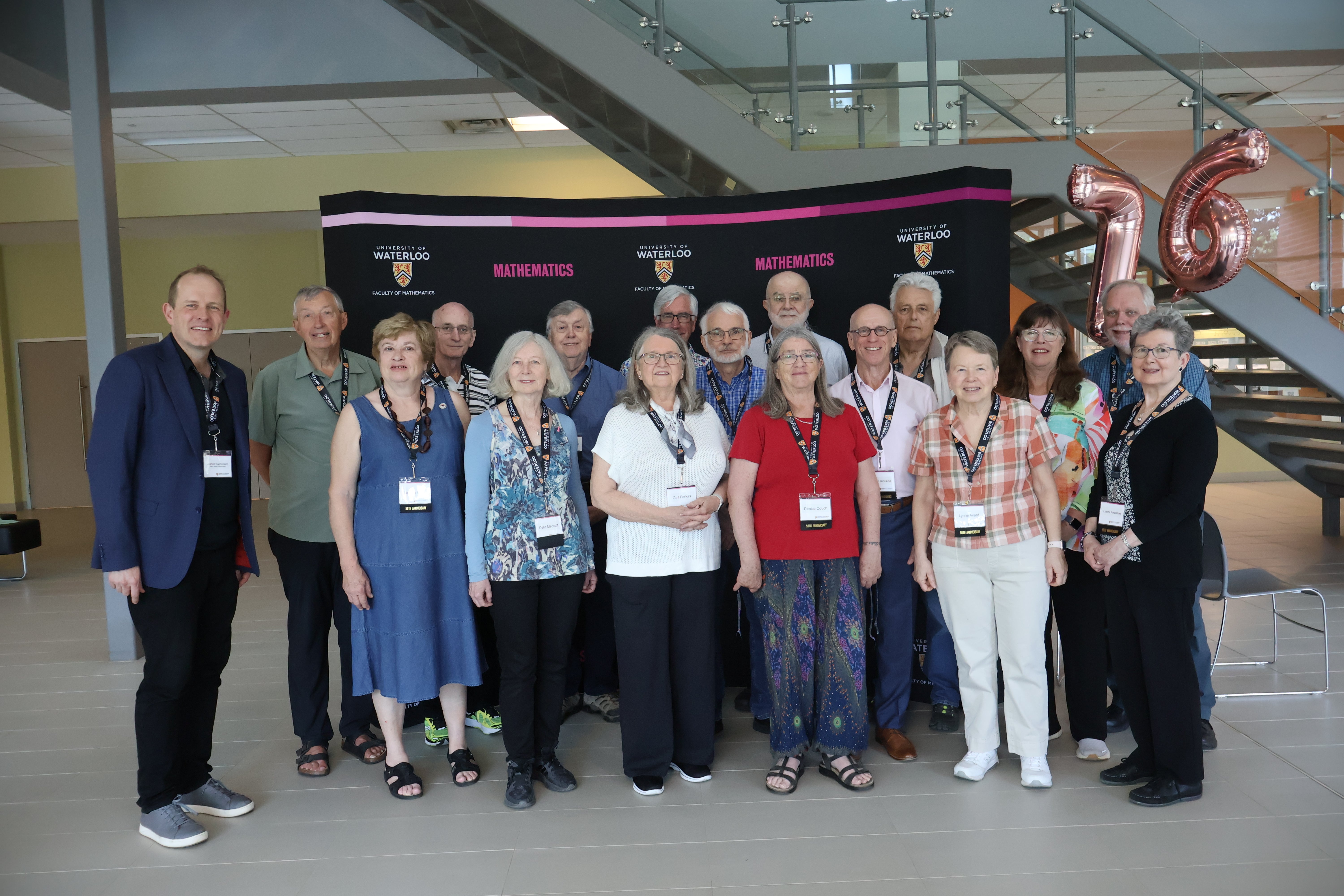 group of people standing and smiling