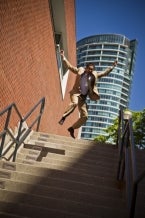 Man jumping down stairs.