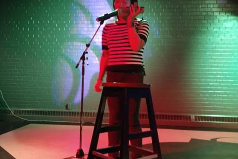 A student performing on stage