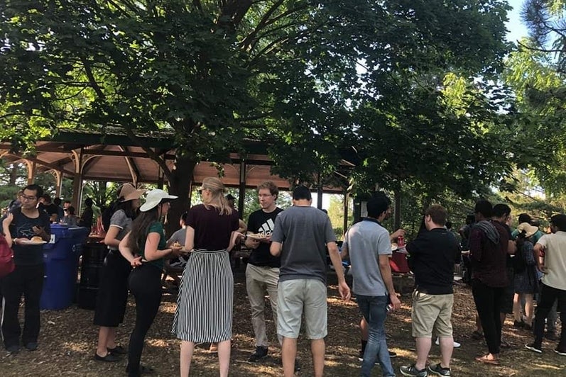 A group of students standing in a park