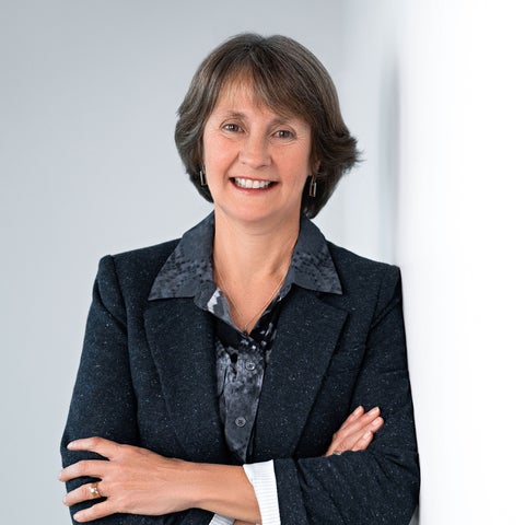 Headshot of a woman with short brown hair