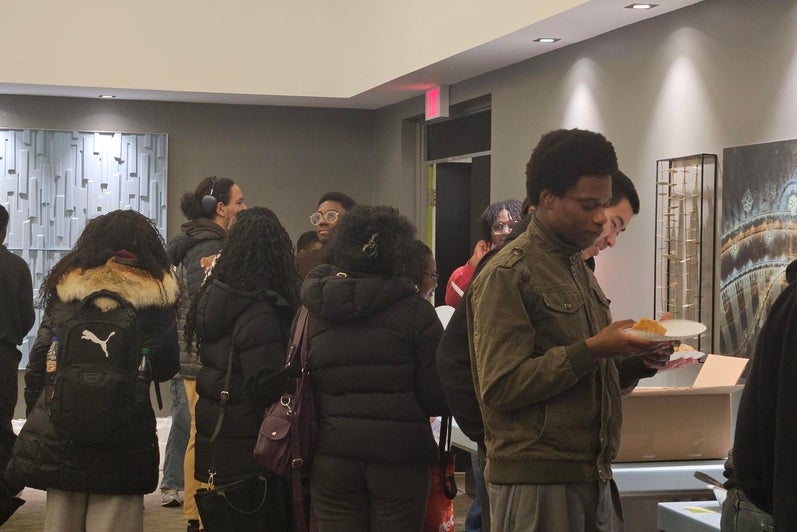 People grabbing food and drinks