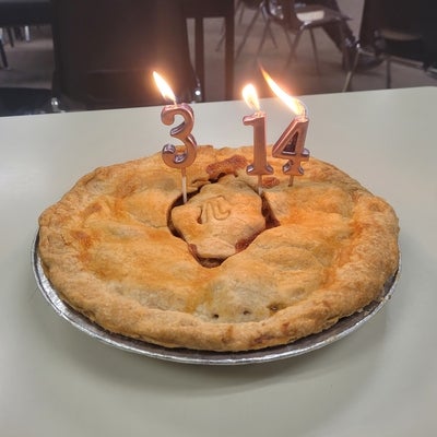 a pie with candles