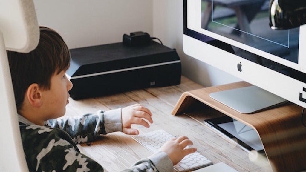 Child doing work on a computer