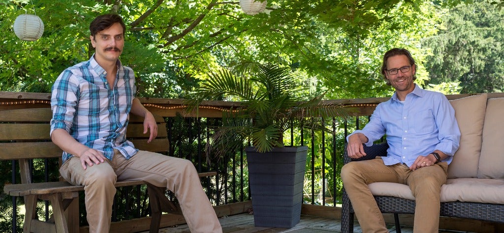Nolan Shaw and Jeff Orchard sitting on a deck