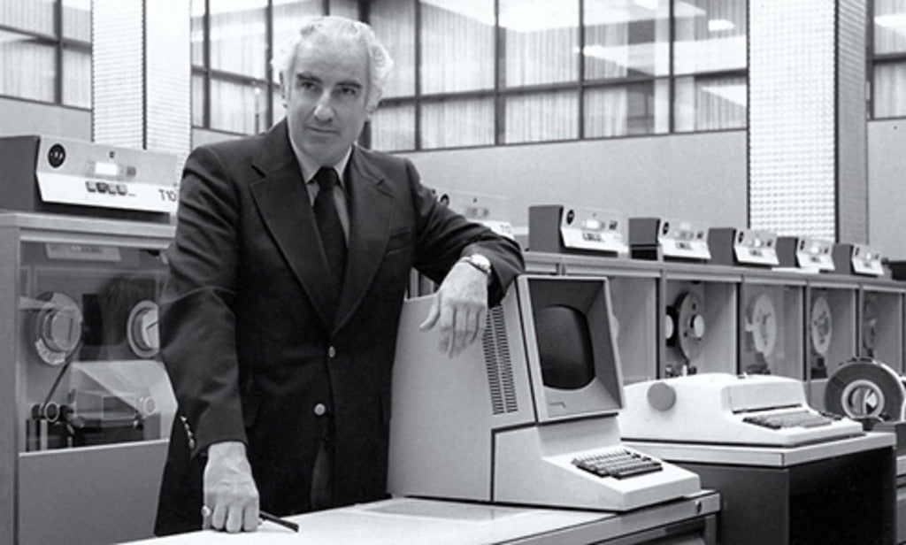 Wes Graham at the University of Waterloo beside an IBM 360/75