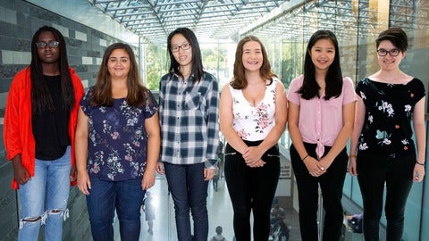 Six female students standing facing the camera. 