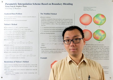 Xiang Fang in front of his poster