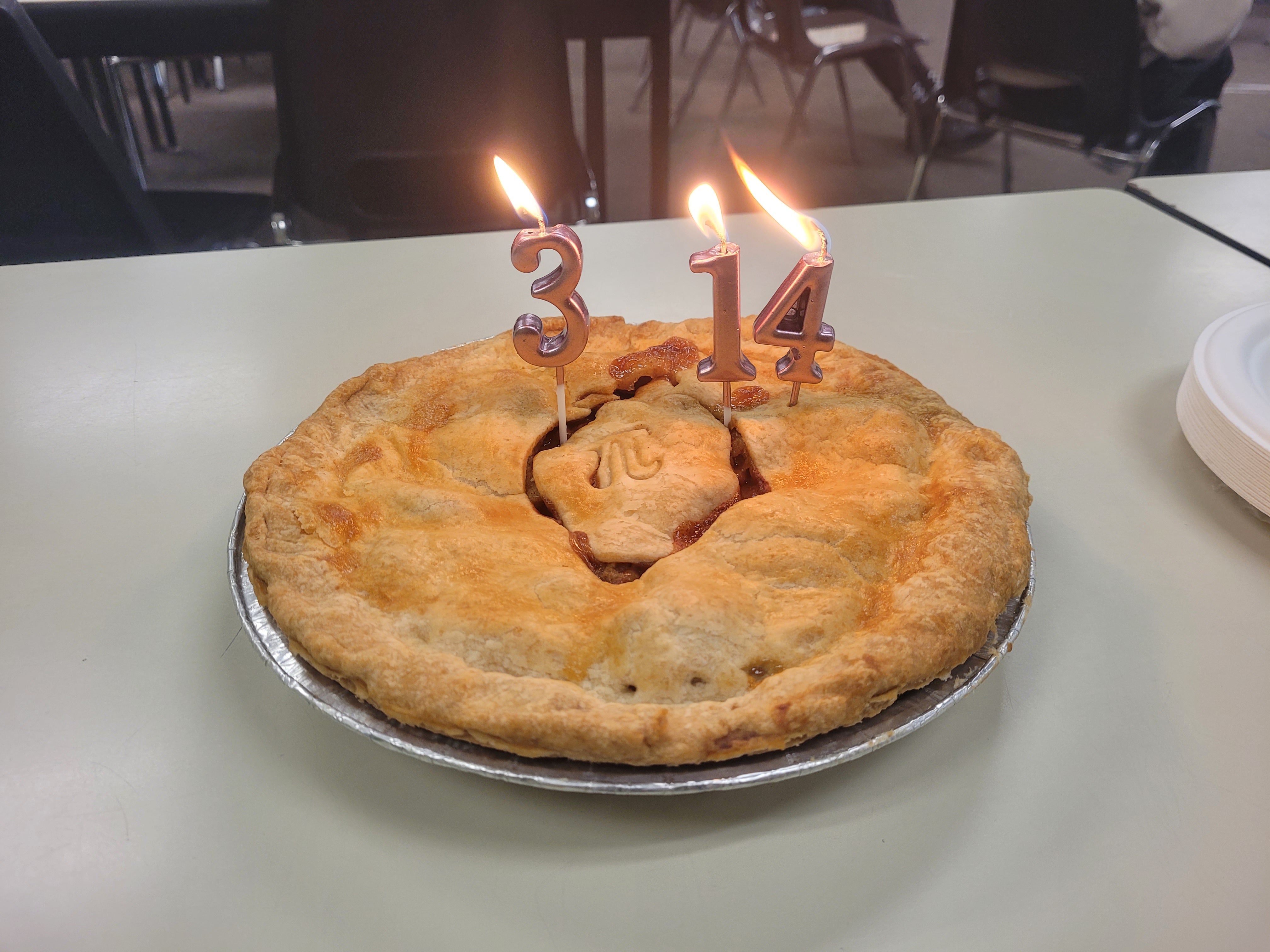 a pie with candles