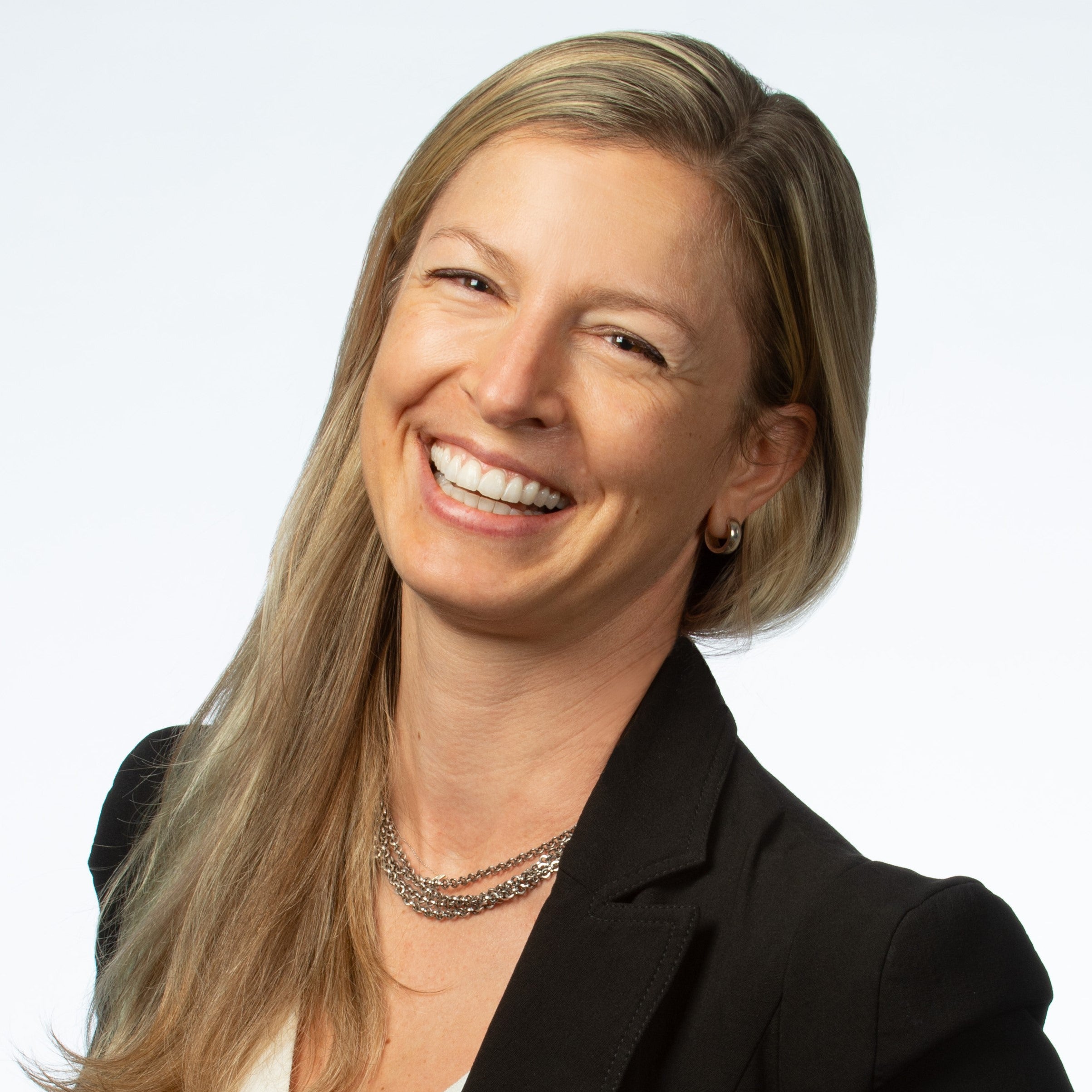 headshot of a woman with long blond hair smiling