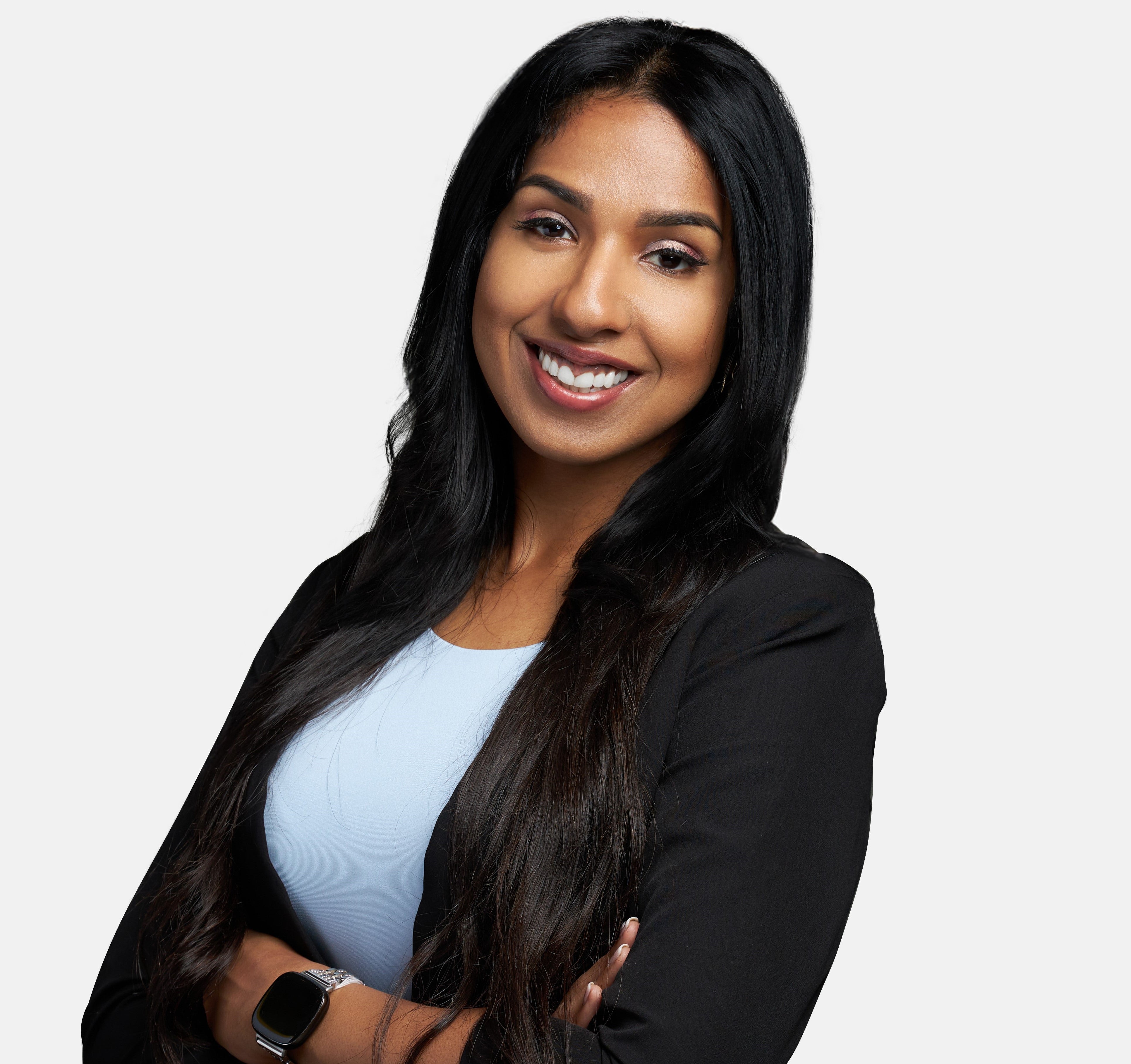 young woman with long dark hair smiling
