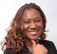 black woman smiling with a thumb up