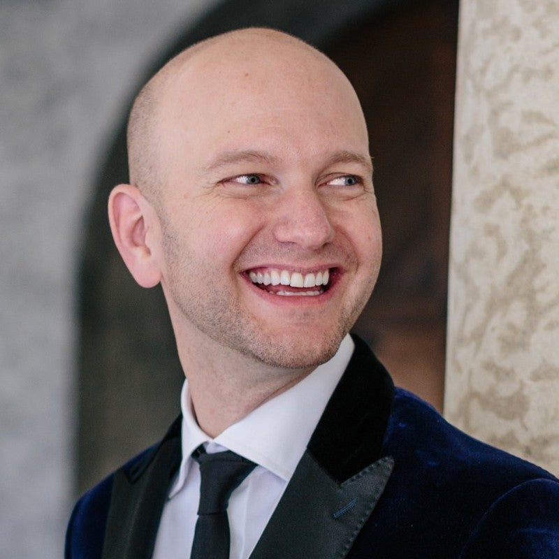 headshot of a man smiling
