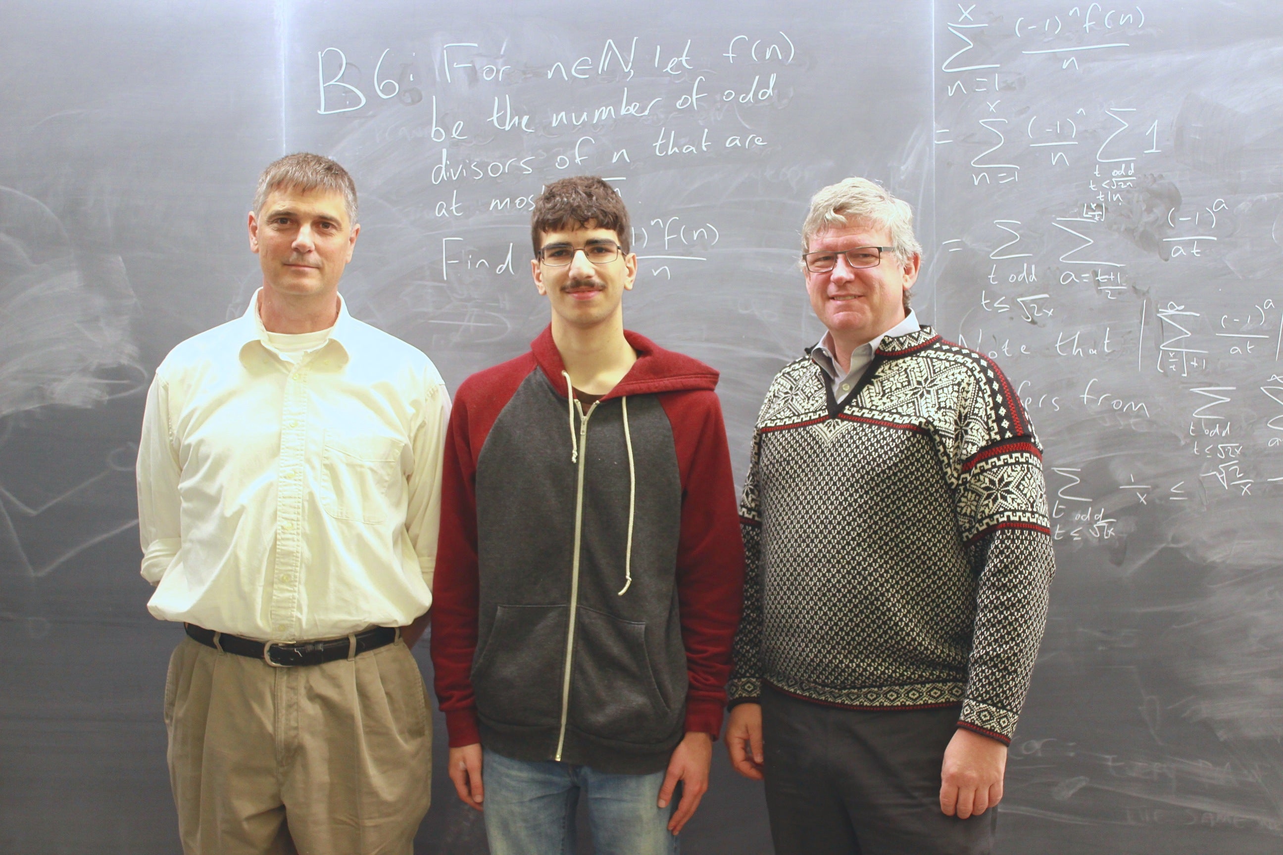 Putnam team coach, Stephen New stands with Putnam Fellow Daniel Spivak and Dean of Mathematics Stephen Watt.