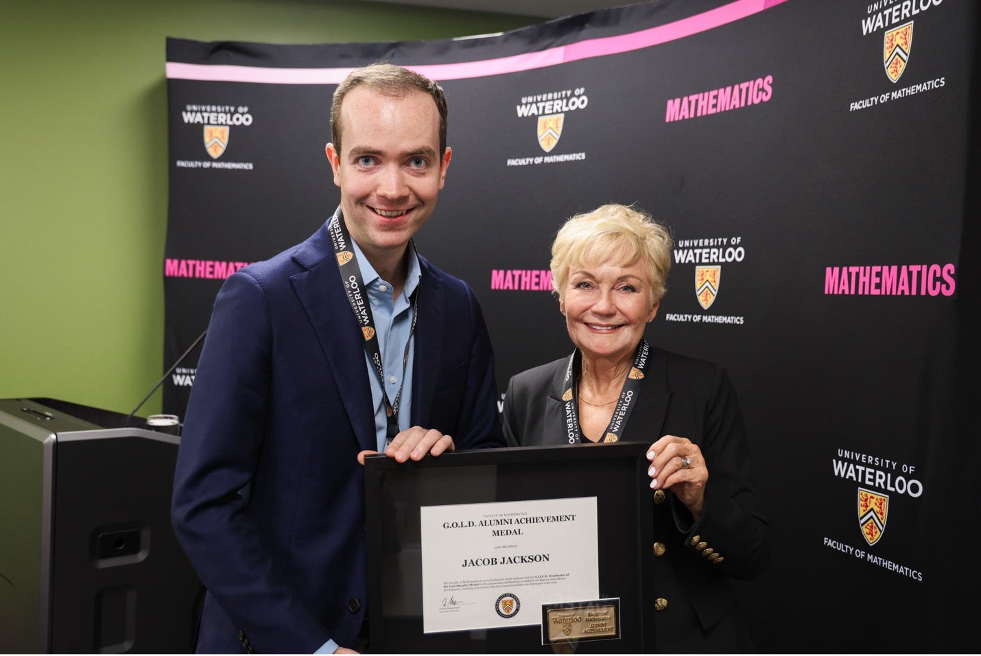 Jacob Jackson poses with Ginny Dybenko and his award.