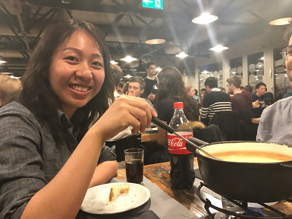 Me (Yutong Wu) trying cheese fondue at the exchange student orientation 