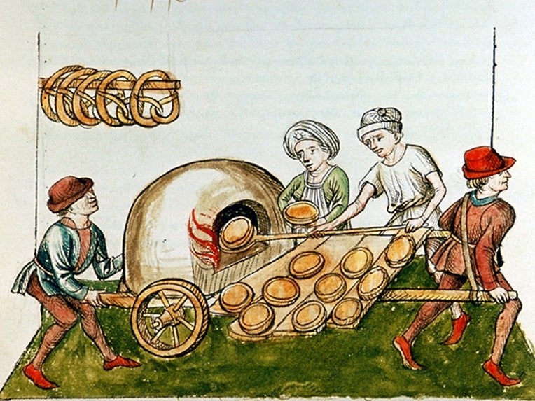 Medieval art of people making pies