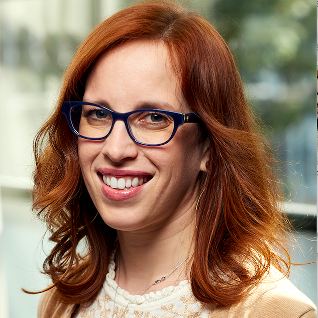 female brunette hair with glasses smiling