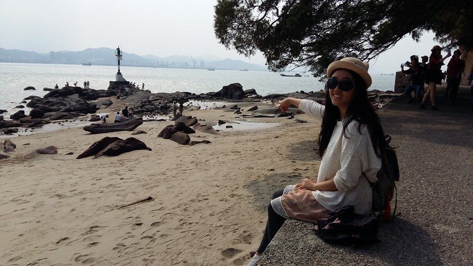 Lemeng Feng sitting along the shore