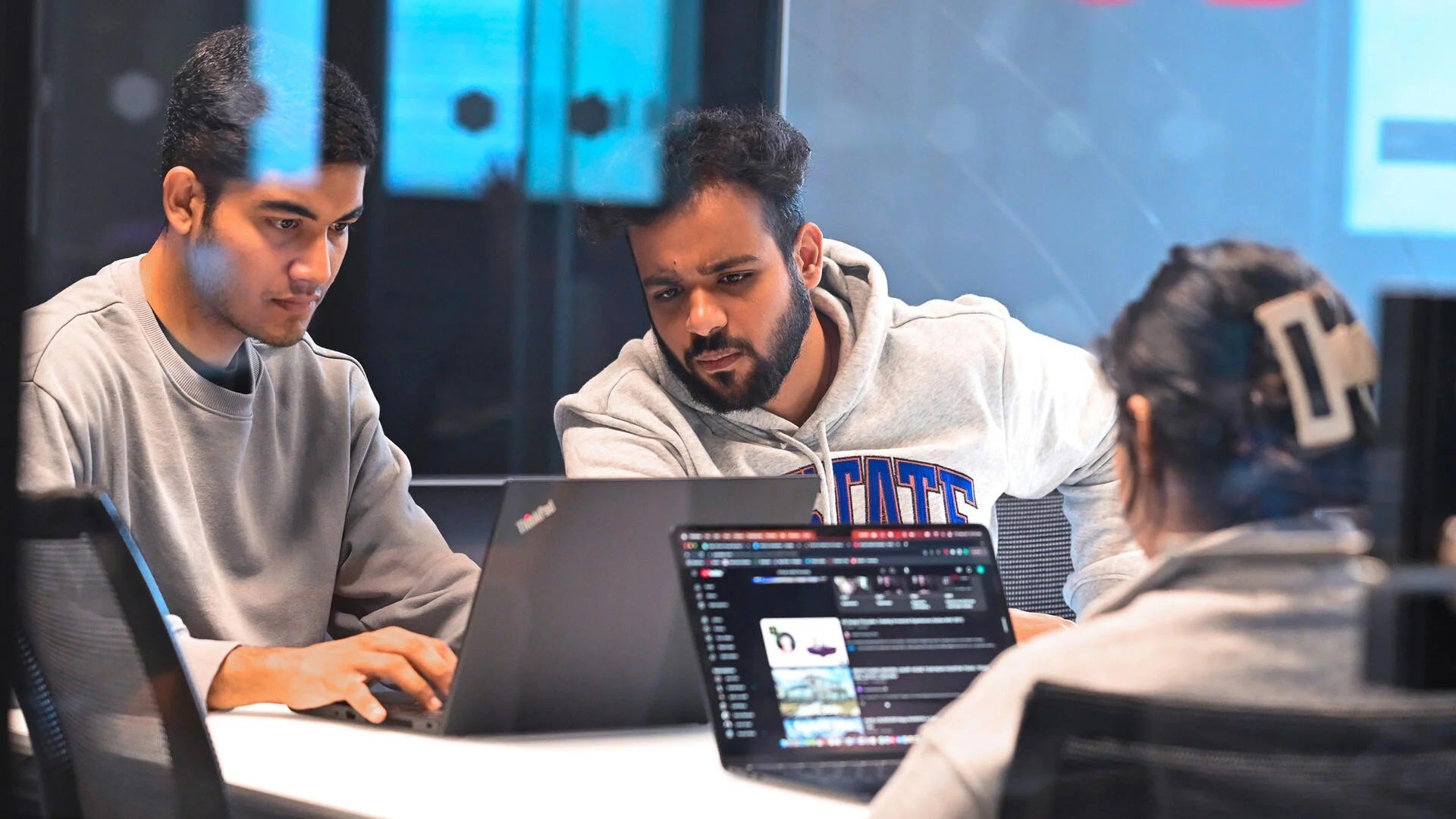 Students looking at their laptop