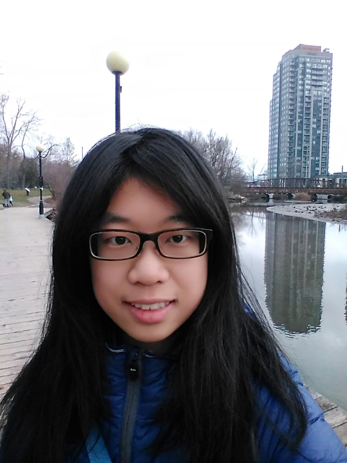 Xinyue Xie, a young woman of Asian descent with dark hair and glasses