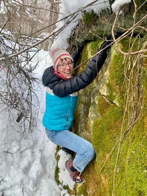 Mackenzie climbing in the snow