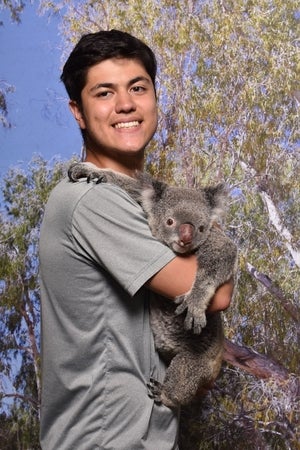 Ken holds a koala 