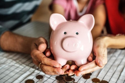 People holding piggy bank