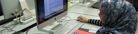 Female student working at a computer