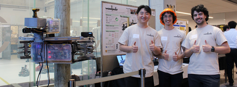 3 students standing with their capstone design