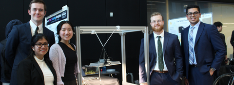 5 students standing with their capstone design project