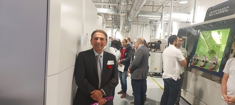 Dr. Ehsan Toyserkani stand front of the Lab