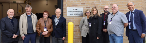 Present and past department chairs, current professors, and supporters gather in front of MME's new welding lab
