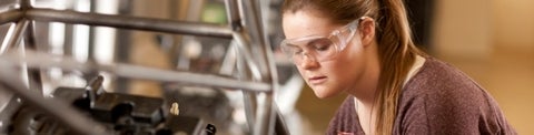 Photo of female undergraduate student working on a project