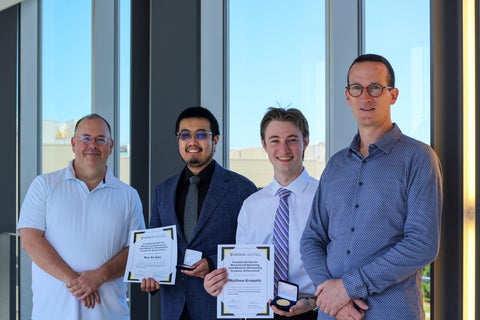 Department Chair, and Associate Chair, Undergraduate studies, pose pose with 2 of the 3 awardees