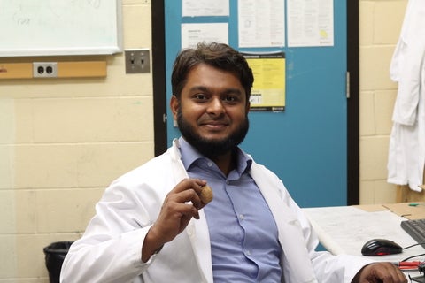 Portrait of Nazmul Hossain with a nut