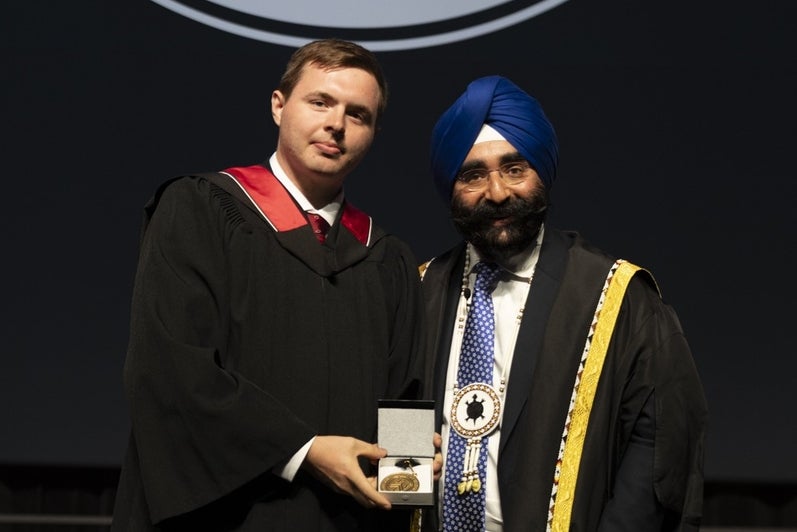 Matthew with Jagdeep Singh Bachher at convocation